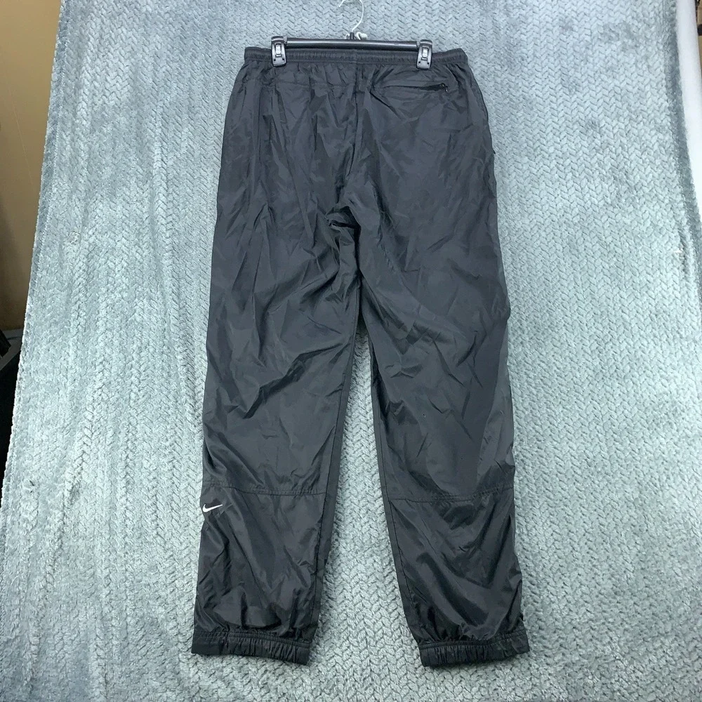 Nike Kids L 12-14 Black Nylon Windbreaker Track Pants Lined Zipper Cuffs Joggers